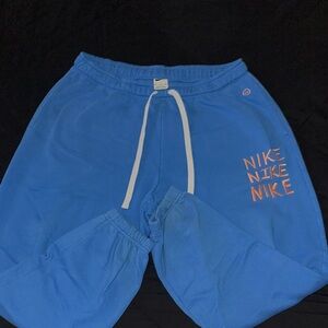 Nike Men’s Blue Joggers with Orange Accents